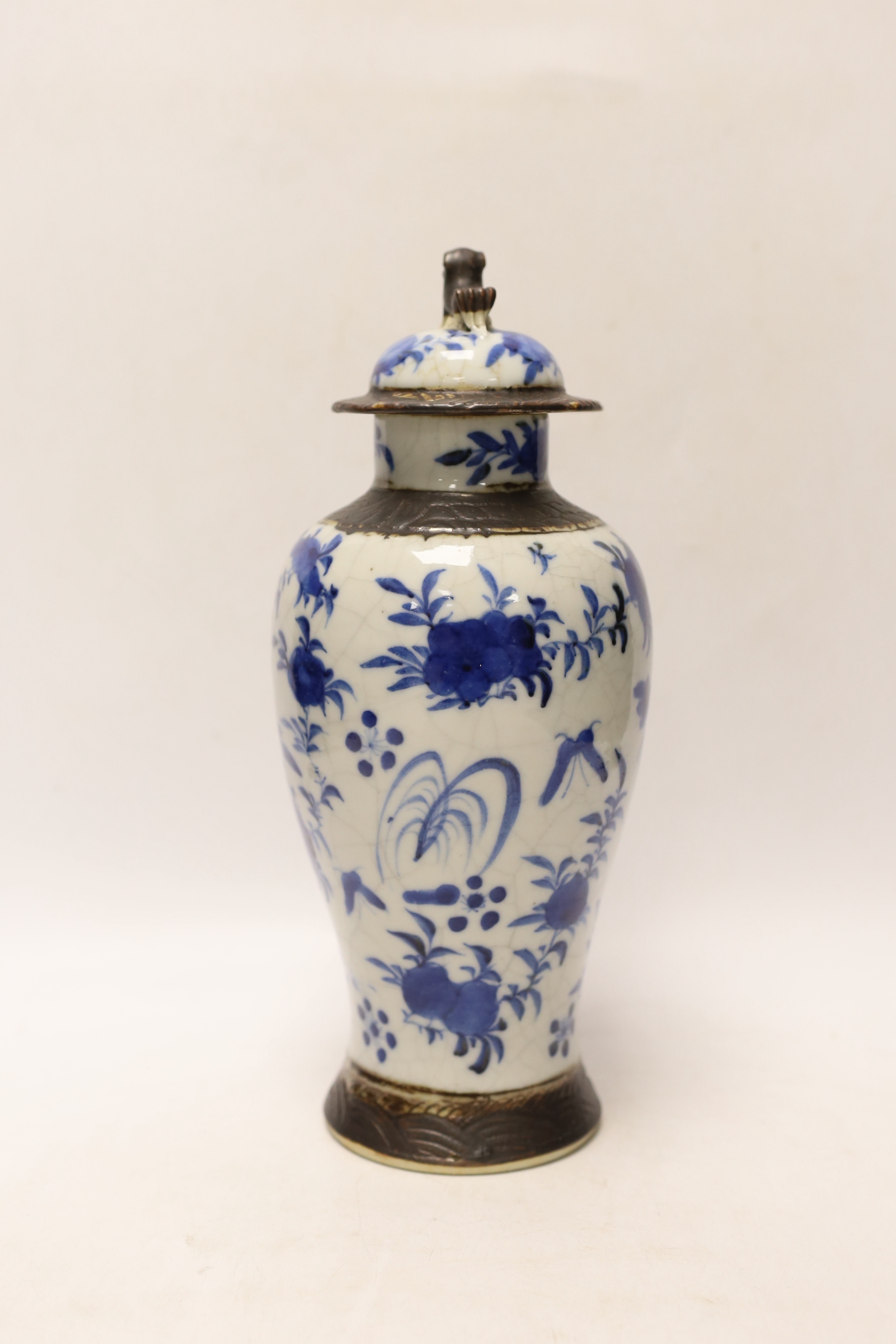 A late 19th century Chinese crackle glaze vase and cover, 30cm